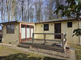 Klicken, um Details zum Objekt zu erhalten Bungalow Wohnwagen Mobilheim Ansicht auf dem Ostsee Campingplatz