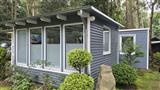 Klicken, um Details zum Objekt zu erhalten Bungalow Wohnwagen Mobilheim Ansicht auf dem Ostsee Campingplatz